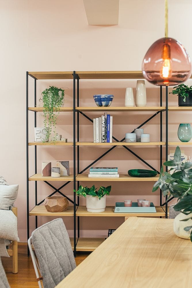 Styled open shelving with plants and warm neutral home decor