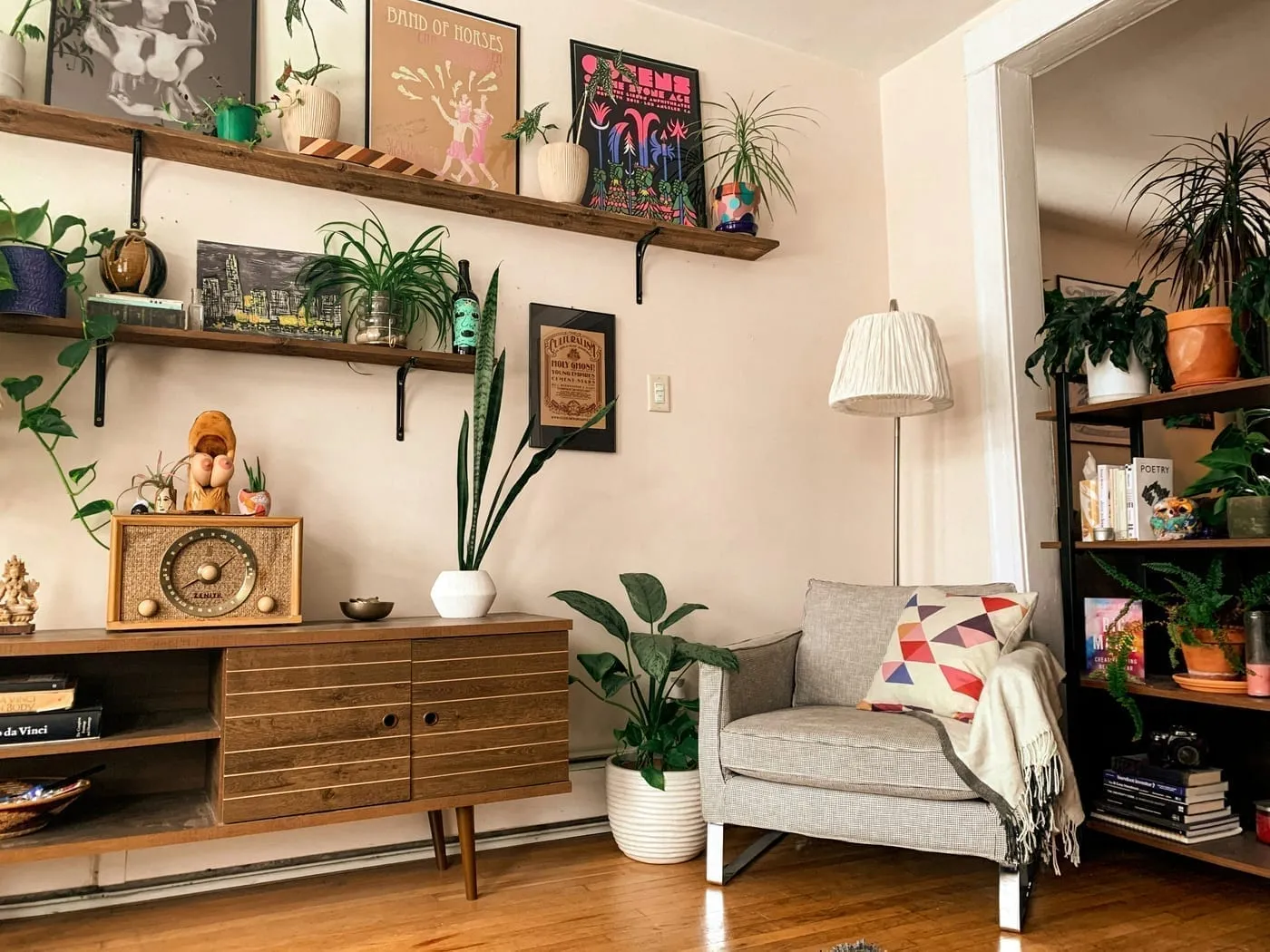 Styled shelves with books, plants, and woven baskets — the formula for intentional decor