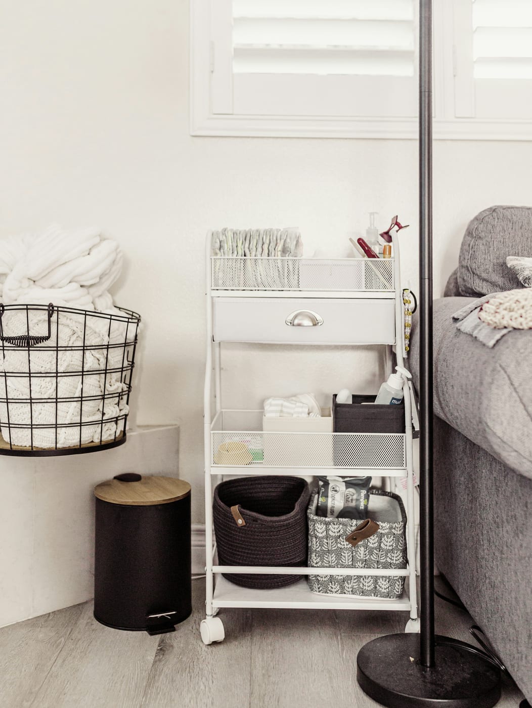 Floor-to-ceiling BILLY bookshelves maximize vertical storage in a small apartment