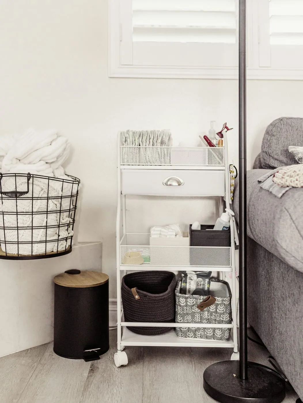 Floor-to-ceiling BILLY bookshelves maximize vertical storage in a small apartment