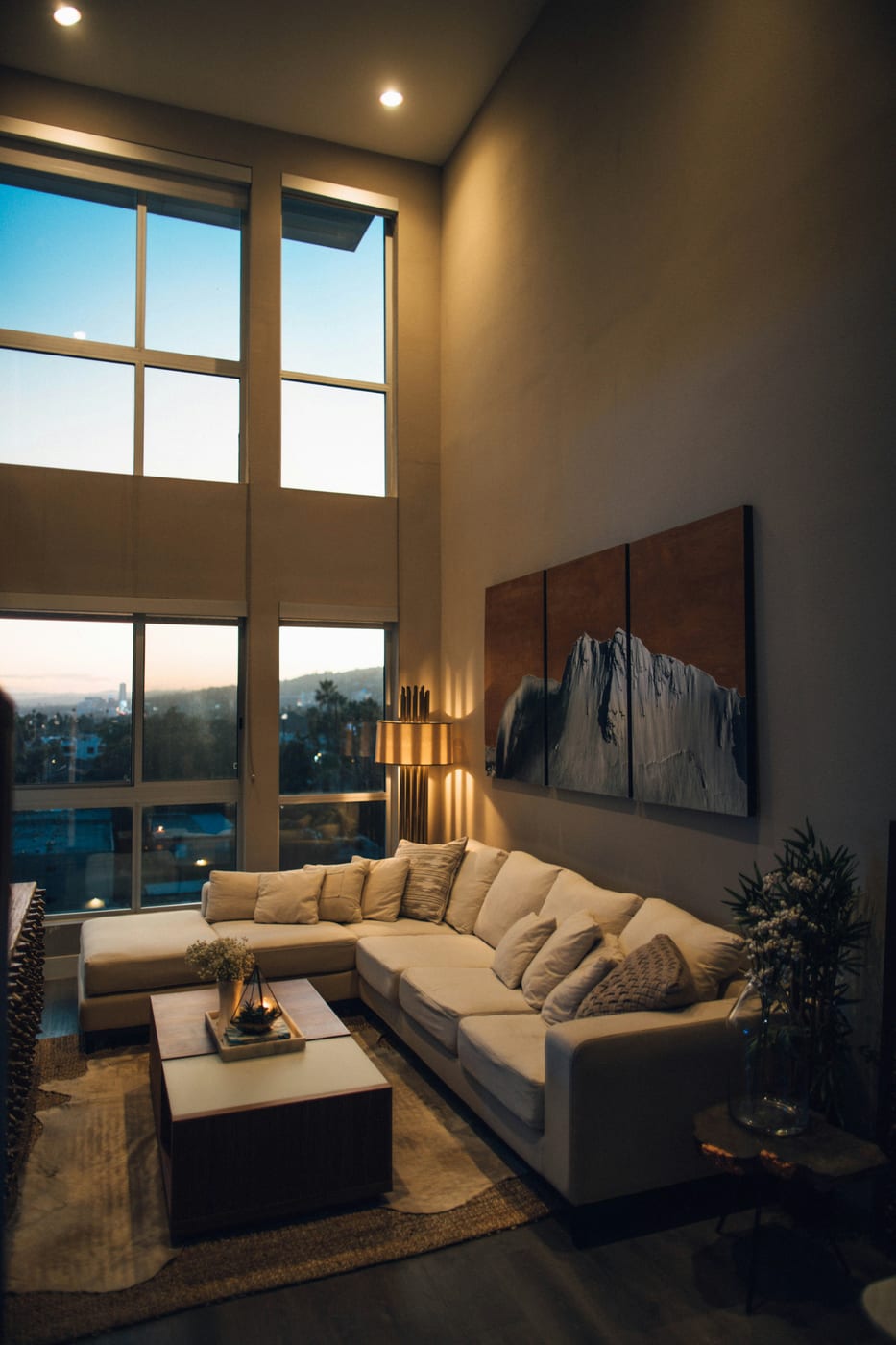 A gallery wall with mixed frames hung using Command strips in a Canadian rental apartment