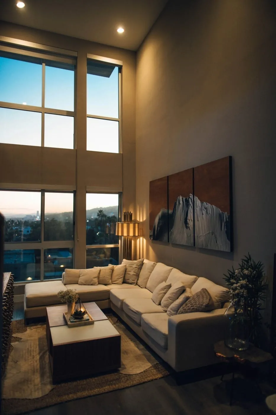A gallery wall with mixed frames hung using Command strips in a Canadian rental apartment