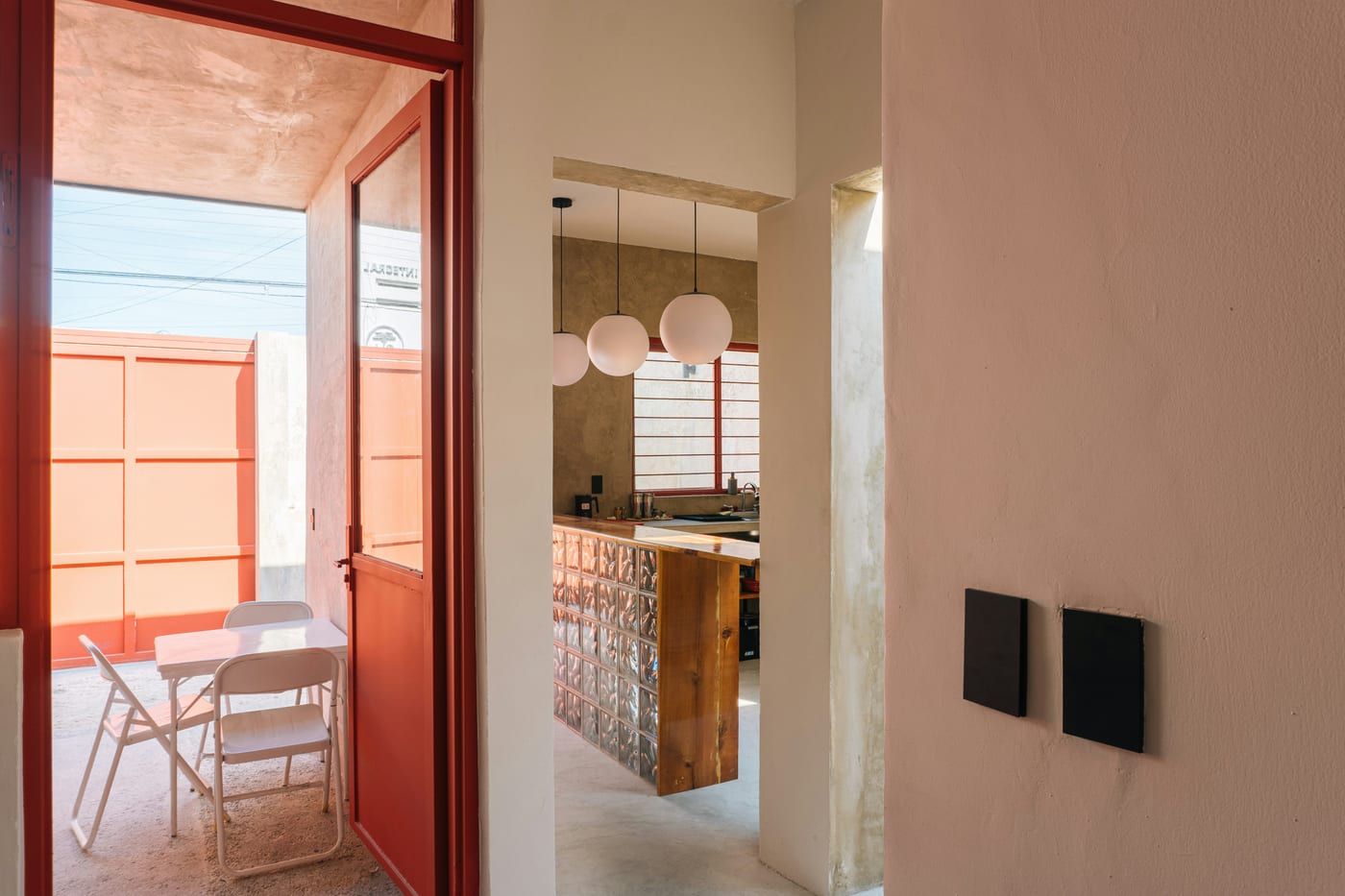 A leaning full-length mirror opposite a window doubles the light and adds visual depth to a small room