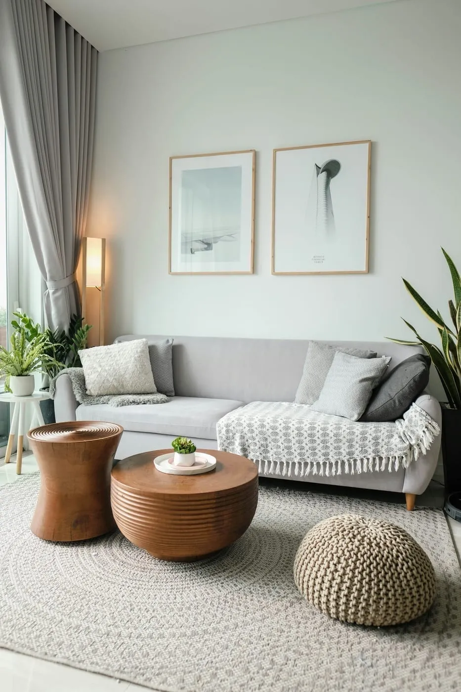 A large area rug anchoring the sofa and coffee table in a small Canadian apartment living room