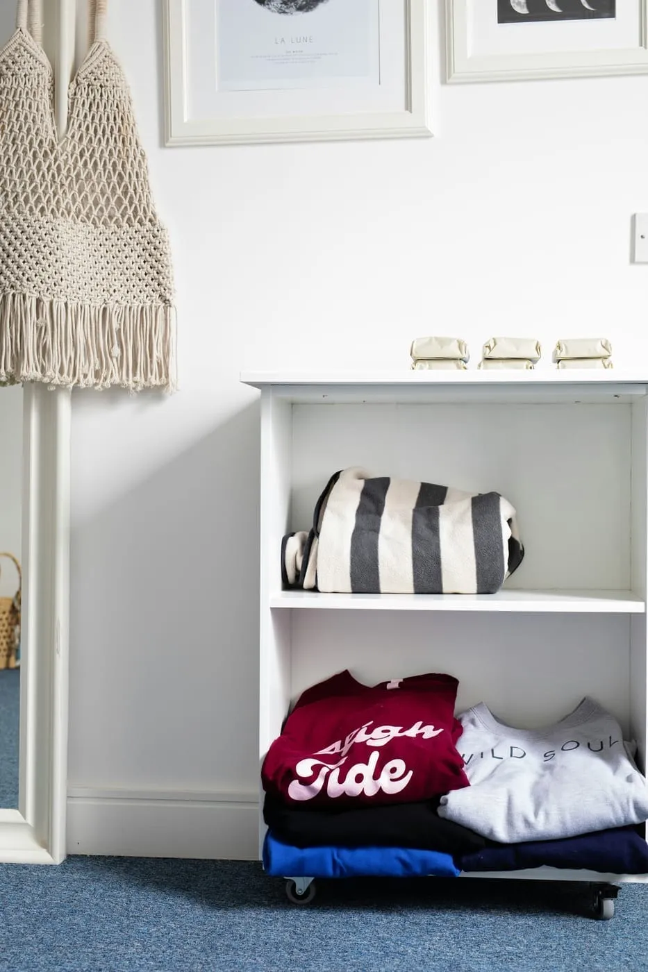 A second tension rod installed below the main closet rod doubles hanging space for short items instantly