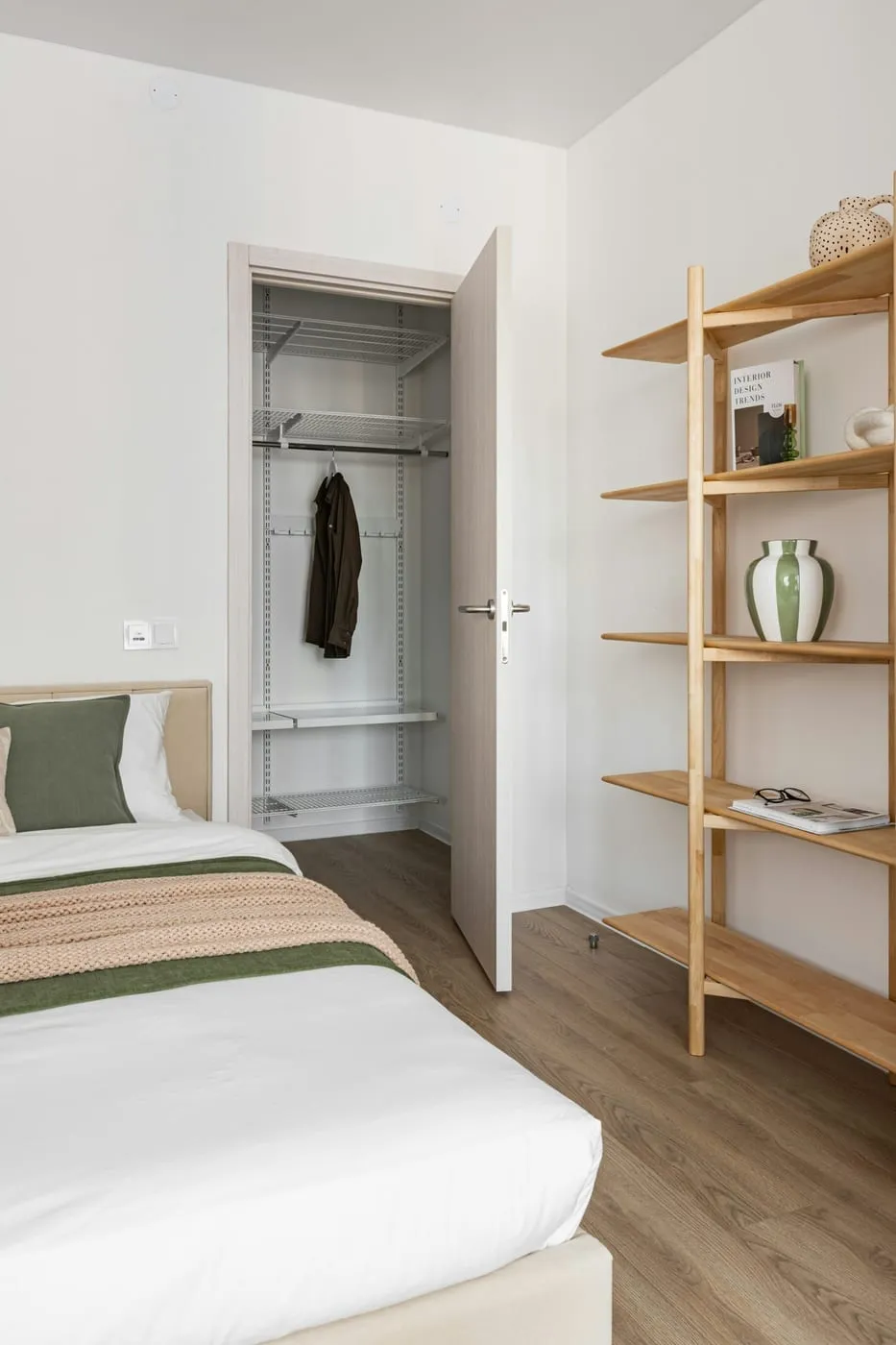 IKEA PAX wardrobe providing a complete closet system in a small bedroom with no built-in closet