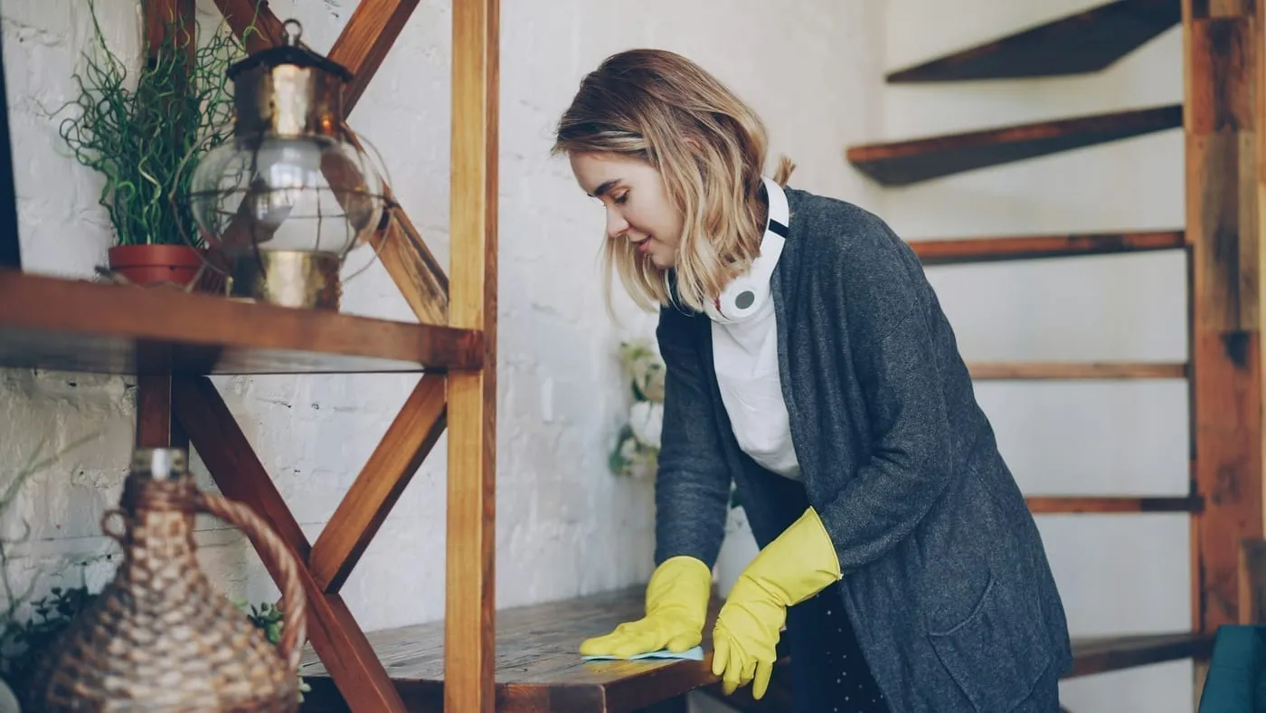 A freshly decluttered bedroom closet after spring cleaning — seasonal clothing swapped and everything in its place