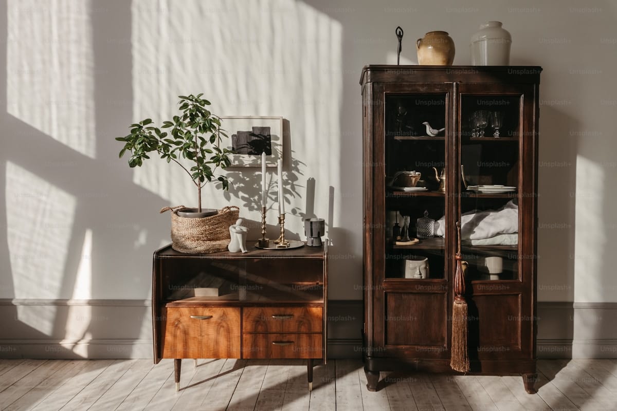 A bookcase styled with autumn botanicals and organic textures — natural elements from outside are the most authentic fall decor