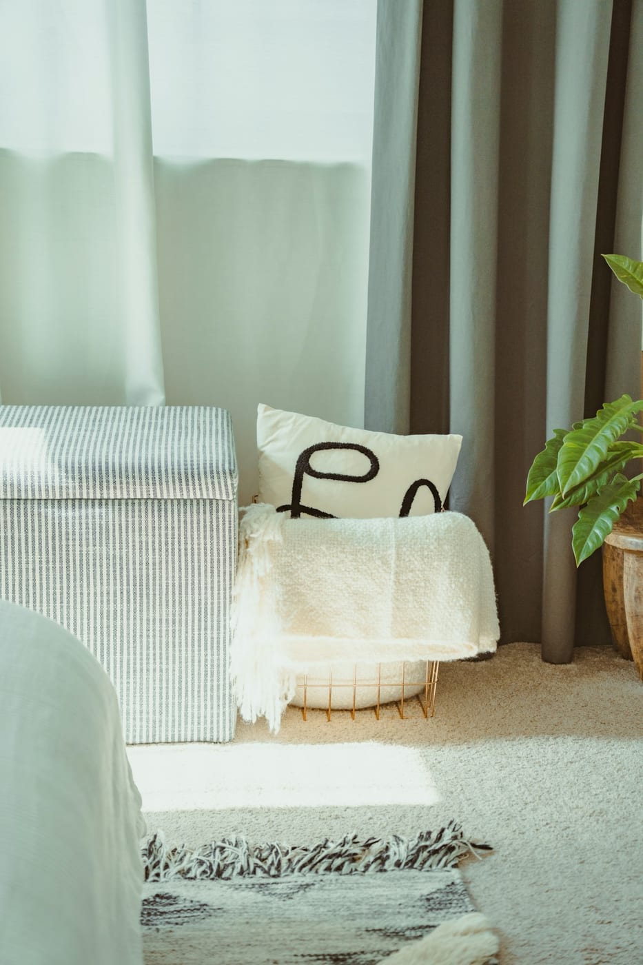 A storage ottoman does triple duty as seating, coffee table, and hidden storage