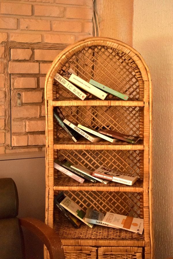 A minimal apartment entryway system with hooks, shoe rack, and a tray for daily essentials